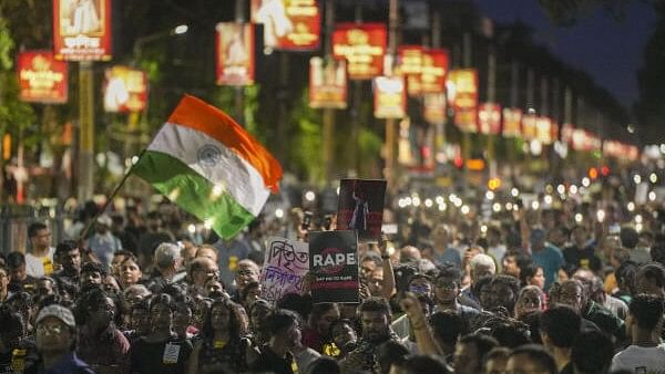 <div class="paragraphs"><p>People take part in a protest march over the alleged sexual assault and murder of a trainee doctor, in Kolkata, Sunday, Sept. 8, 2024. </p></div>