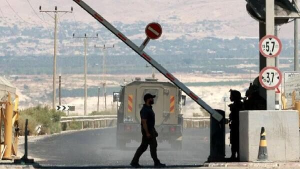 <div class="paragraphs"><p>A man walks at a barrier, at the Allenby Bridge Crossing between the West Bank and Jordan, following a shooting incident at the crossing in the Israeli-occupied West Bank, September 8, 2024. </p></div>