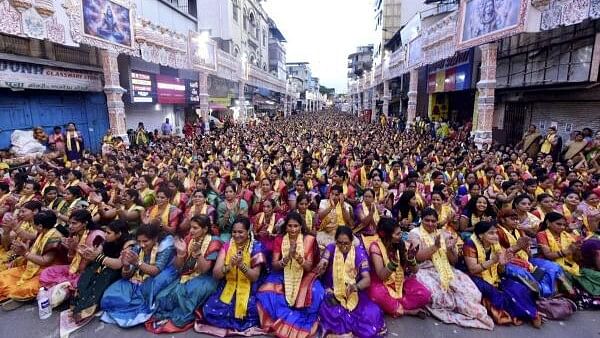 <div class="paragraphs"><p>Women participate in Atharvashirsha Pathan.</p></div>