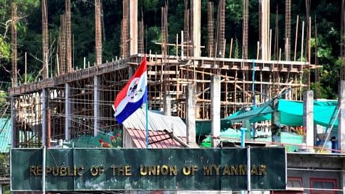 <div class="paragraphs"><p>A flag of one of the Myanmar rebel forces is installed next to an under-construction structure in Myanmar's Khawmawi village on the India-Myanmar border. Representative image</p></div>