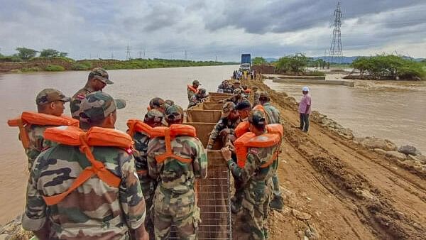 <div class="paragraphs"><p> Indian Army personnel during a disaster relief operation in collaboration with local authorities in a flood-affected area, in Vijayawada.</p></div>