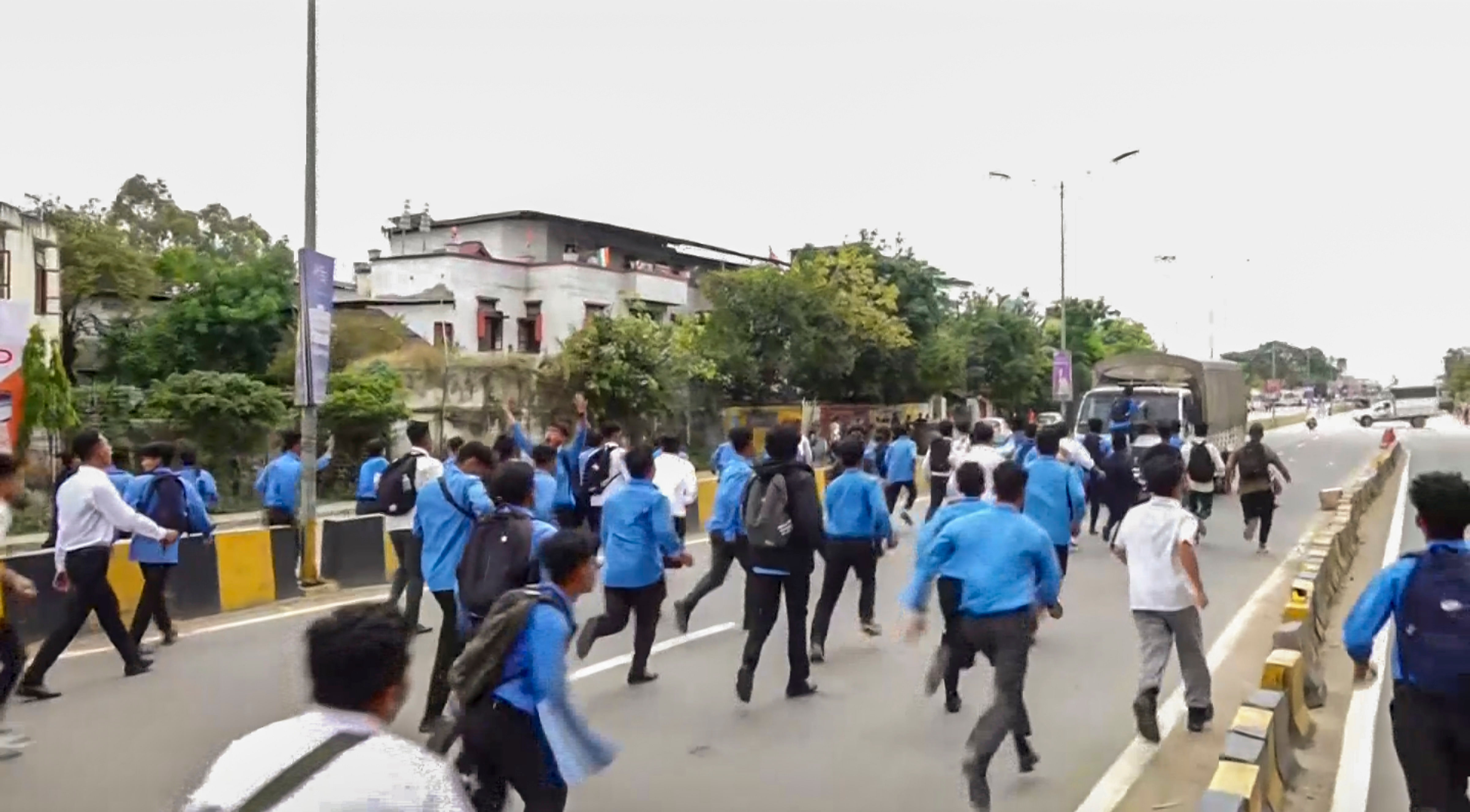 <div class="paragraphs"><p>Members of All Manipur Students' Union (AMSU) charge towards a CRPF convoy during a protest march against the recent violence in the state, in Imphal, Monday, Sept 9, 2024. </p></div>