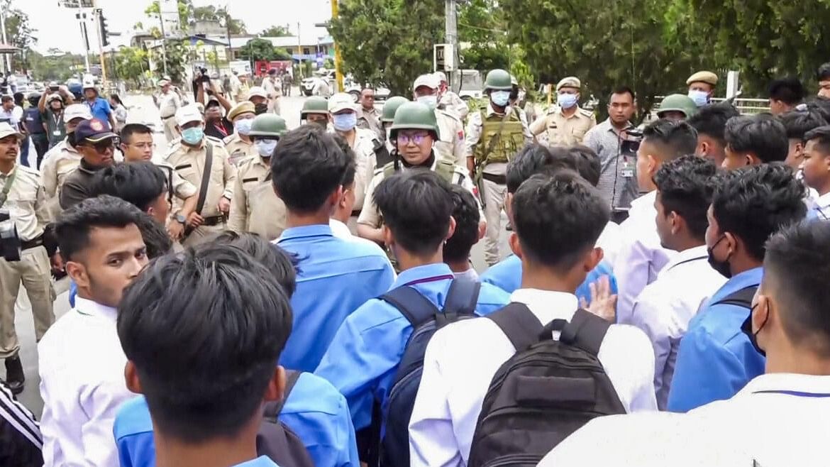 <div class="paragraphs"><p>Police stop students during their protest march over recent violence, in Imphal, Monday, Sept. 9, 2024.</p></div>