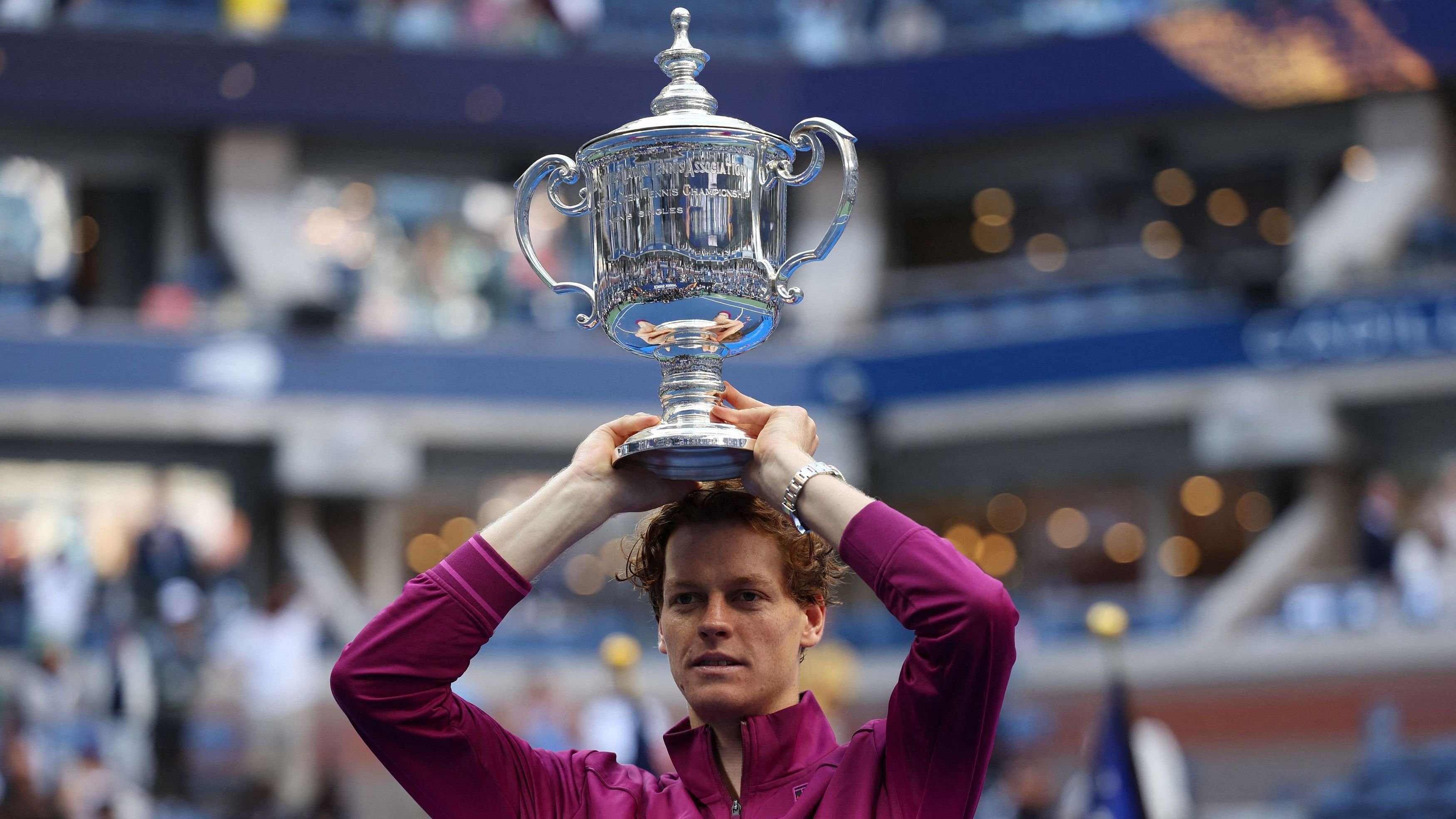 <div class="paragraphs"><p>Italy's Jannik Sinner celebrates with the trophy after winning his final match against Taylor Fritz of the US</p></div>