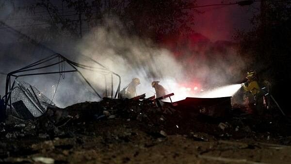 <div class="paragraphs"><p>Firefighters work to extinguish hot spots in burned structures as the Boyles Fire burns in Clearlake, California.&nbsp;</p></div>