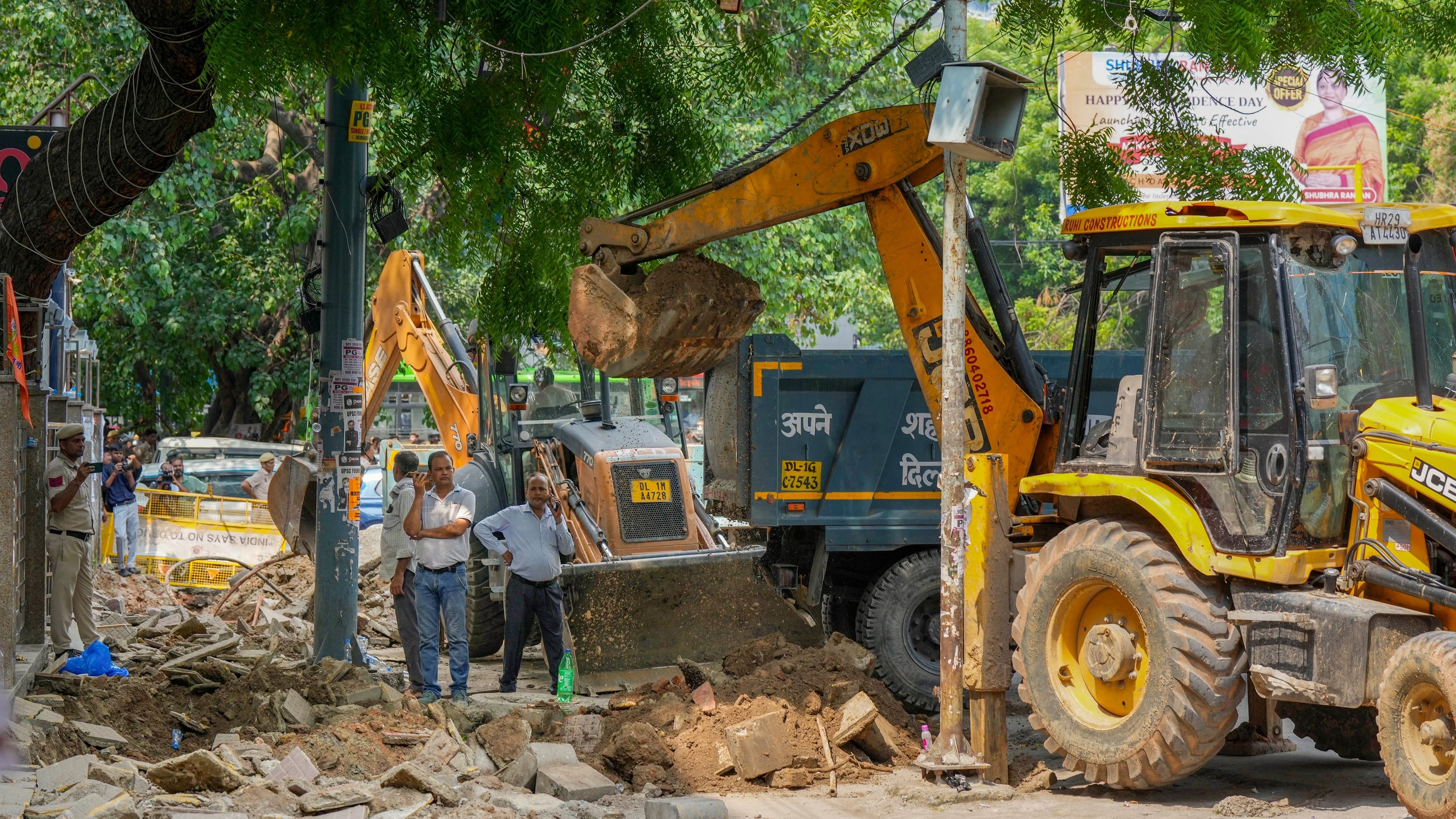 <div class="paragraphs"><p>A bulldozer was pressed into action by the Surat Municipal Corporation (SMC) to raze illegal concrete and temporary constructions and remove handcarts of street vendors in the area.</p></div>