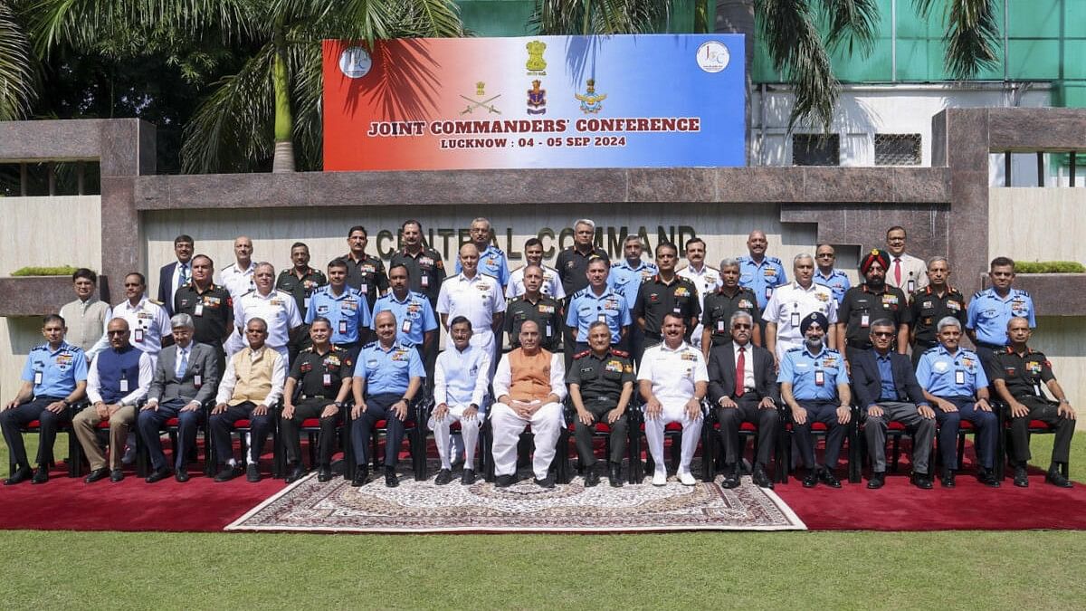 <div class="paragraphs"><p>Defence Minister Rajnath Singh with defence forces personnel during 2nd day of the Joint Commanders’ Conference 2024, in Lucknow.</p></div>