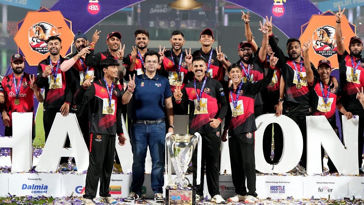 <div class="paragraphs"><p>East Delhi Riders players celebrate with the trophy after winning the Delhi Premier League, at Arun Jaitley Stadium, in New Delhi.</p></div>