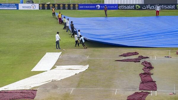 <div class="paragraphs"><p>Groundsmen remove the cover of the pitch before the start of second day of a one-off Test match between Afghanistan and New Zealand, at Shaheed Vijay Singh Pathik Sports complex in Greater Noida on Tuesday, Sept 10, 2024. </p></div>