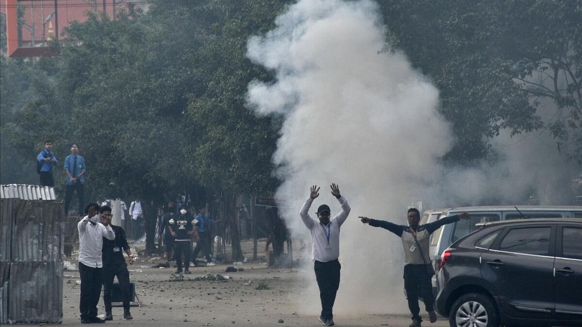 <div class="paragraphs"><p>Smoke billows from a tear gas shell fired by police to disperse the protesters in Manipur.&nbsp;</p></div>