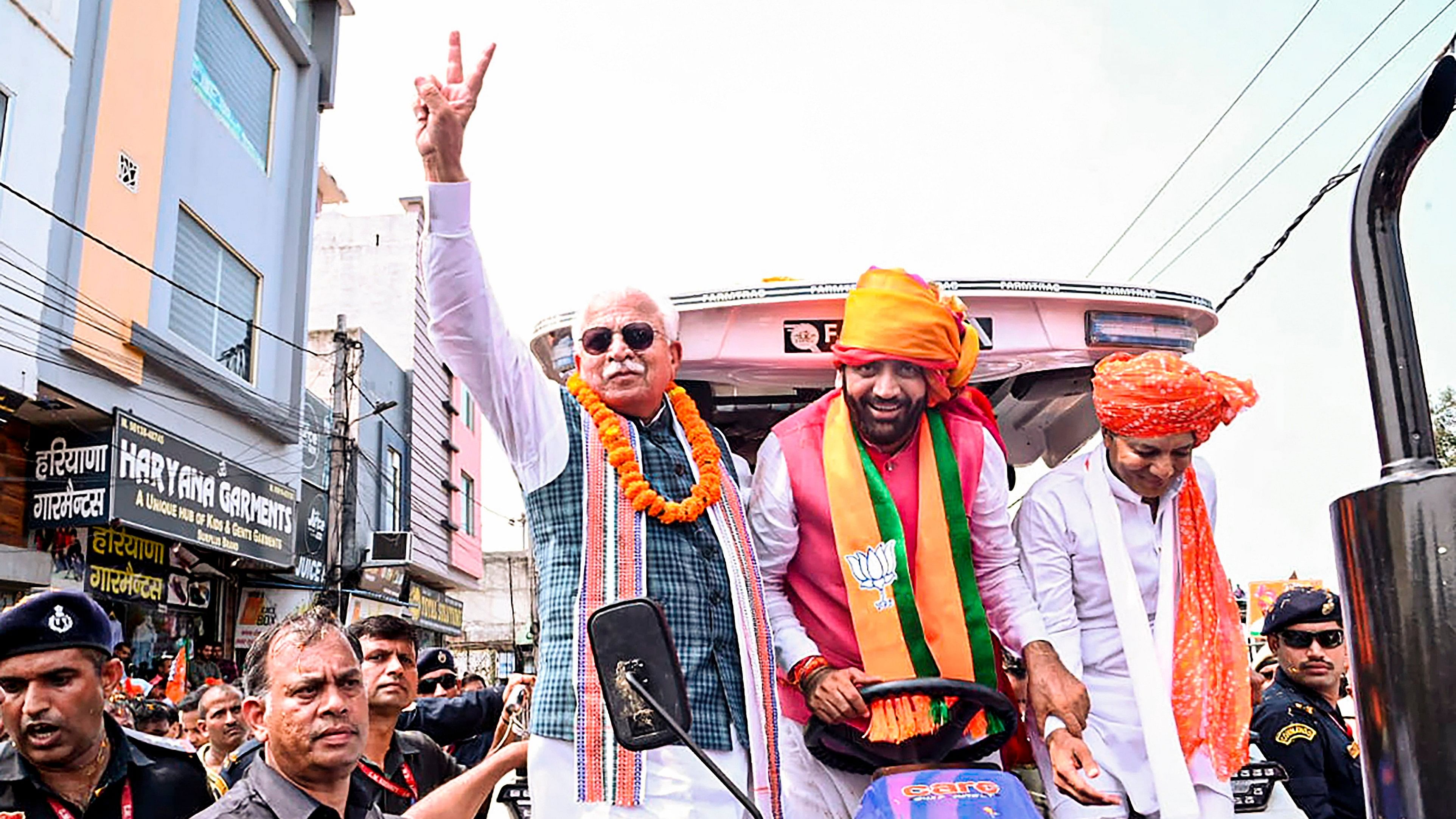 <div class="paragraphs"><p>Union Minister Manohar Lal with Haryana Chief Minister Nayab Saini during a roadshow before filing the latter's nomination for Haryana Assembly elections, in Kurukshetra, Tuesday, September 10, 2024.</p></div>