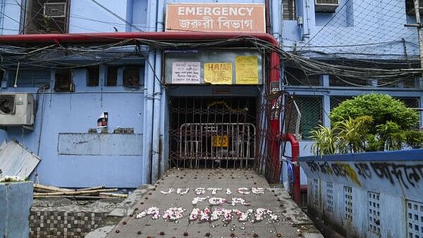 <div class="paragraphs"><p>'Justice For Abhaya' is written with floweres in front of the emergency building at RG Kar Medical College and Hospital as junior doctors cease work against the alleged rape and murder of a trainee doctor, in Kolkata.&nbsp;</p></div>