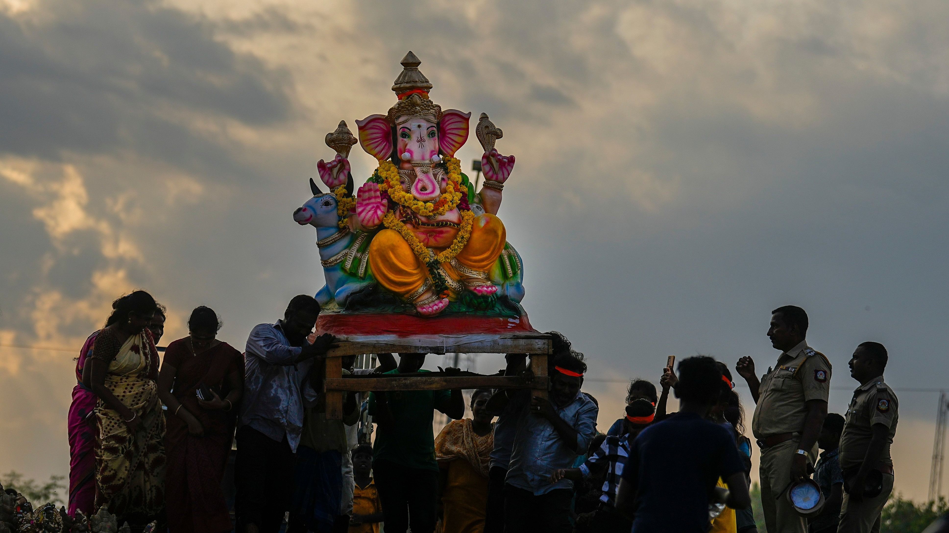 <div class="paragraphs"><p>Chennai: Devotees carry a Lord Ganesha idol to immerse after the Ganesh Chaturthi festival,</p></div>