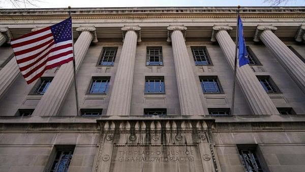 <div class="paragraphs"><p>A flag flies from the Department of Justice in Washington, US.</p></div>