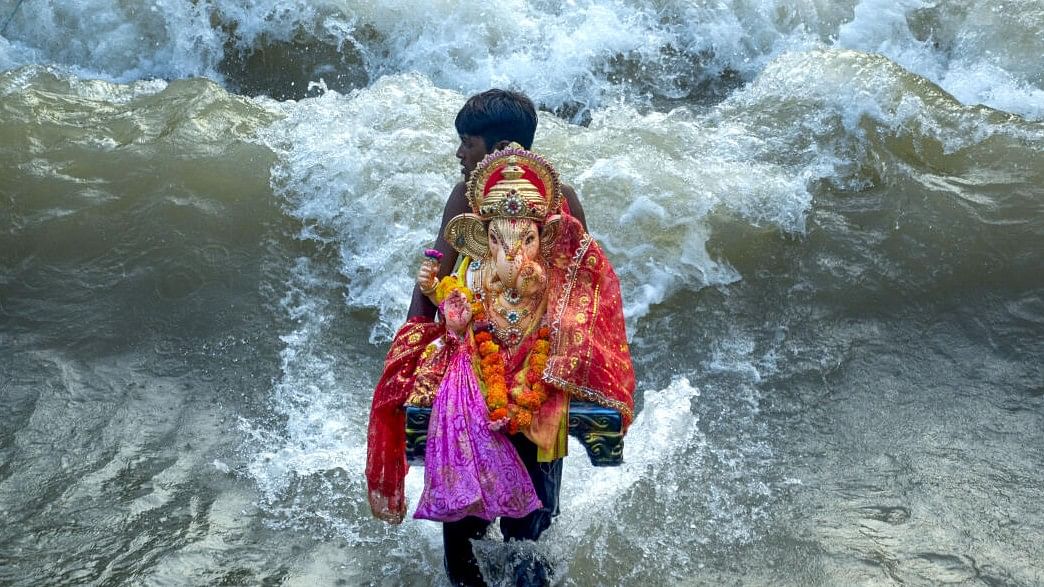 <div class="paragraphs"><p>A Ganpati idol being immersed in water. (Representative image)</p></div>