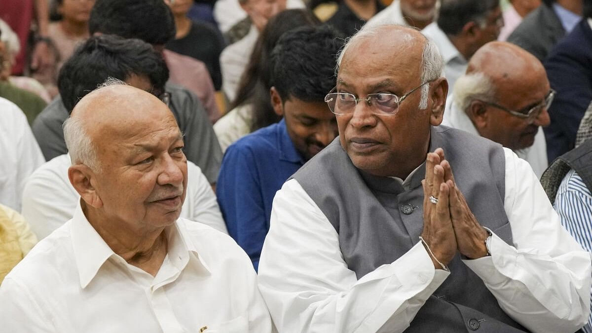 <div class="paragraphs"><p>Congress President Mallikarjun Kharge with party leader Sushil Kumar Shinde during release of the latter's memoir.</p></div>