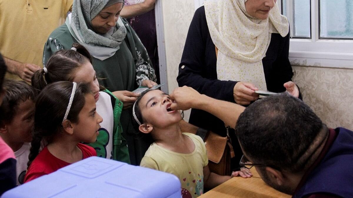 <div class="paragraphs"><p>A Palestinian child is vaccinated against polio, amid the Israel-Hamas conflict, in Jabalia in northern Gaza Strip, September 10, 2024.</p></div>