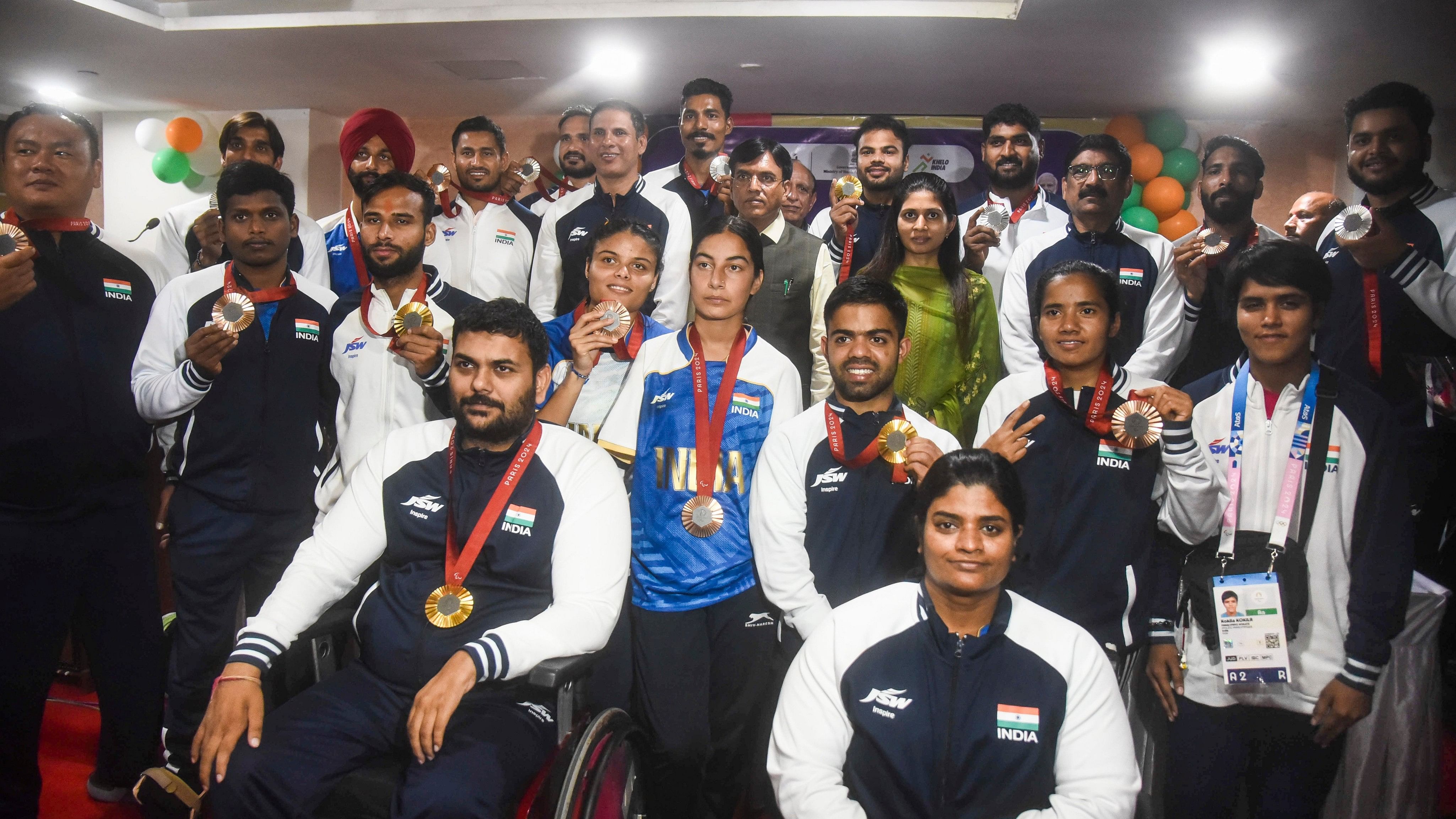 <div class="paragraphs"><p>New Delhi: Para athletes pose for group photos during a felicitation ceremony on their return to India from the Paris Paralympics 2024, in New Delhi, Tuesday, Sept. 10, 2024. </p></div>