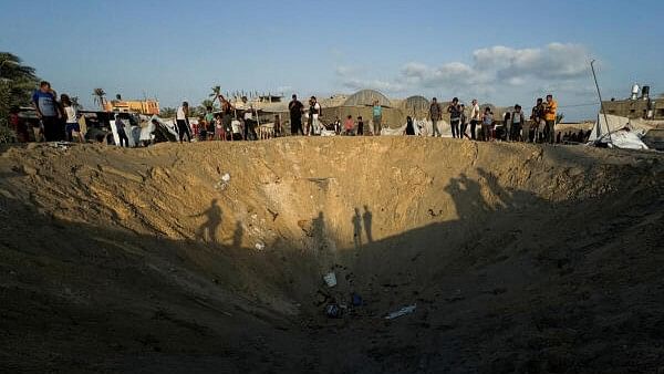 <div class="paragraphs"><p>People inspect the site following Israeli strikes on a tent camp sheltering displaced people, amid the Israel-Hamas conflict, at the Al-Mawasi area in Khan Younis, in the southern Gaza Strip, September 10, 2024. </p></div>