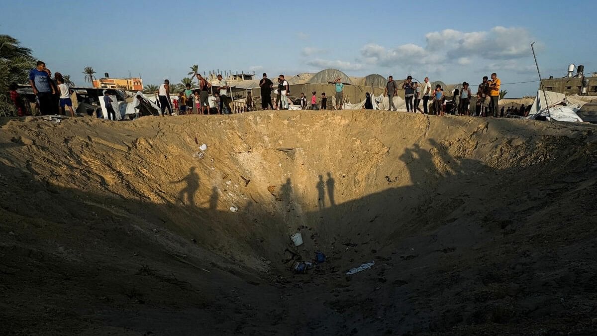 <div class="paragraphs"><p>People inspect the site following Israeli strikes on a tent camp sheltering displaced people, amid the Israel-Hamas conflict, at the Al-Mawasi area in Khan Younis, in the southern Gaza Strip, September 10, 2024.</p></div>