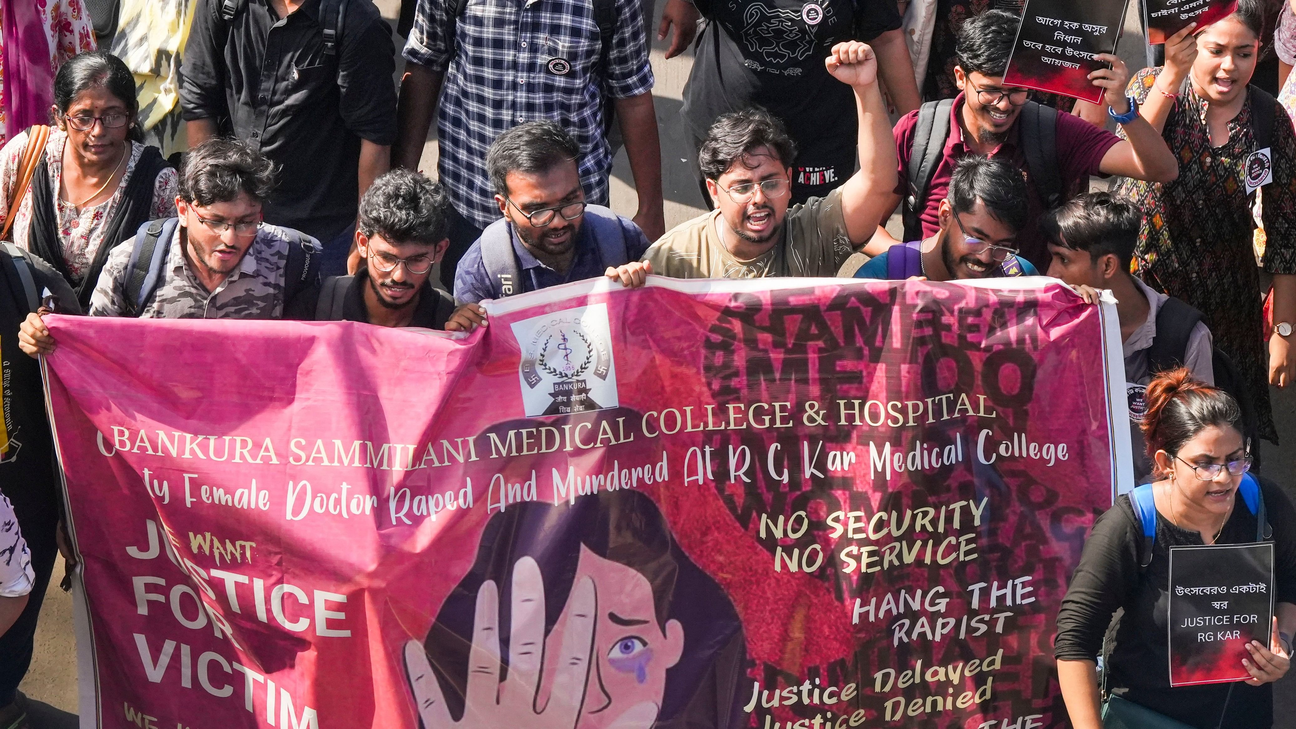 <div class="paragraphs"><p>Junior doctors shout slogans as they march towards Swasthya Bhawan during a protest over RG Kar Hospital rape and murder incident, in Kolkata.</p></div>