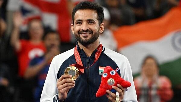 <div class="paragraphs"><p>Nitesh Kumar celebrates after winning gold at the Paris Paralympics.</p></div>