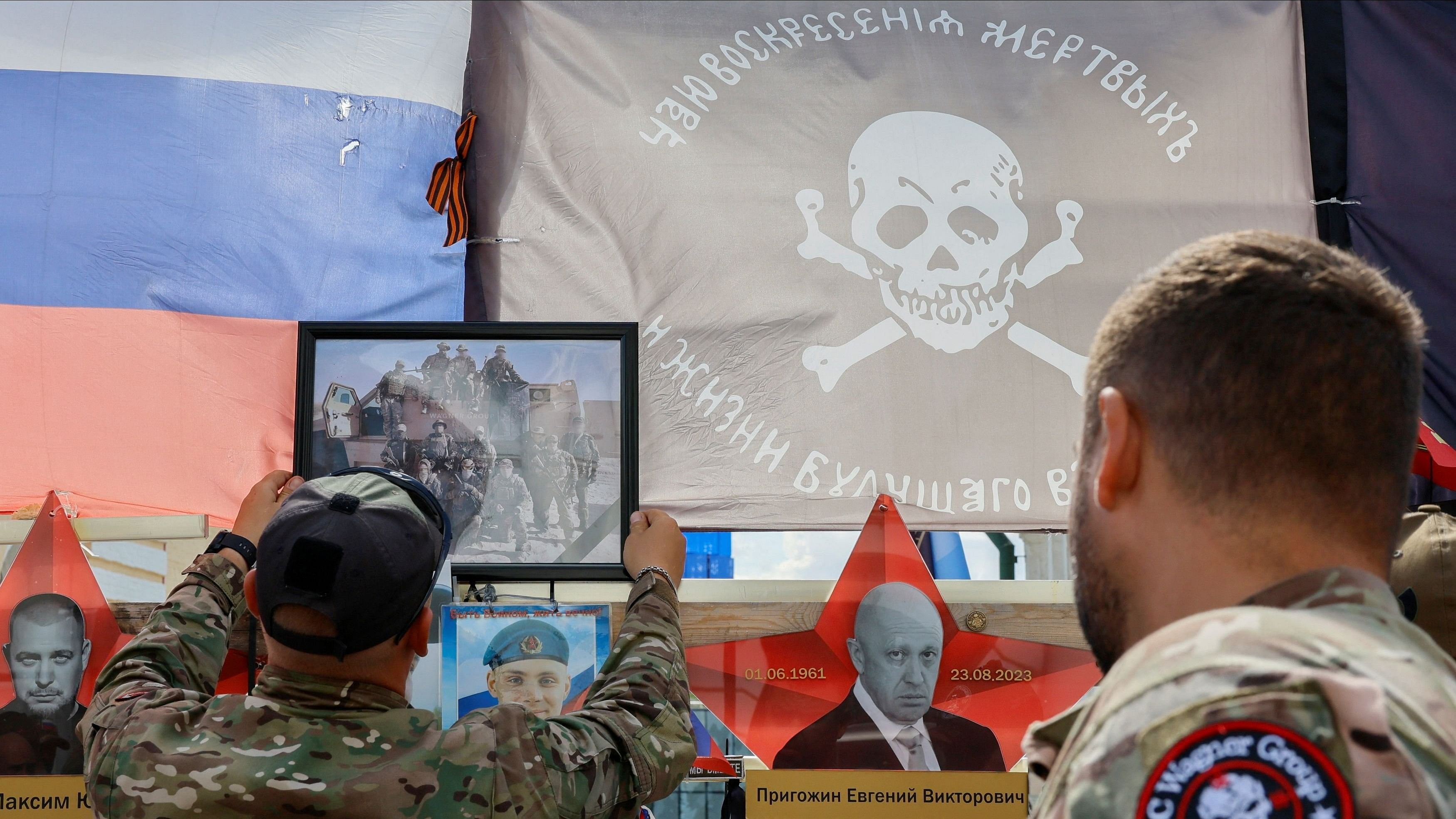 <div class="paragraphs"><p>File Photo: People gather in front of a makeshift memorial, which was erected following head of Russia's Wagner mercenary group Yevgeny Prigozhin and group commander Dmitry Utkin's death in 2023, during a commemoration ceremony held to pay tribute to Wagner fighters, who were recently killed in Mali by northern Tuareg rebels, in central Moscow, Russia August 4, 2024. </p></div>