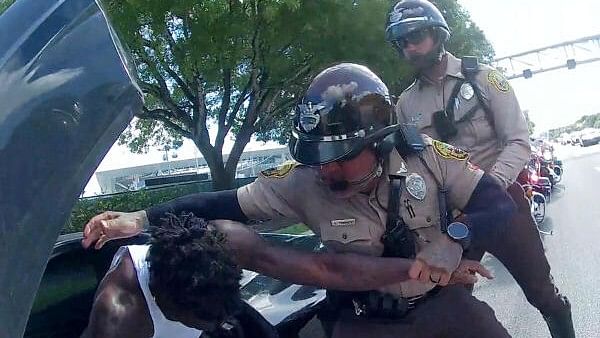 <div class="paragraphs"><p>Miami Dolphins receiver Tyreek Hill is forced from his vehicle by Miami-Dade Police Department officers in Miami.</p></div>