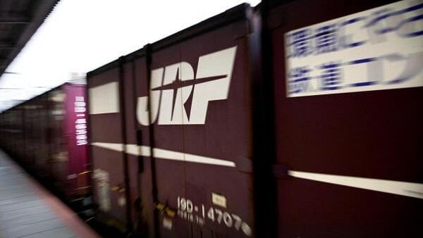 <div class="paragraphs"><p>A Japan Rail (JR) freight train passes through a train station in Osaka.</p></div>