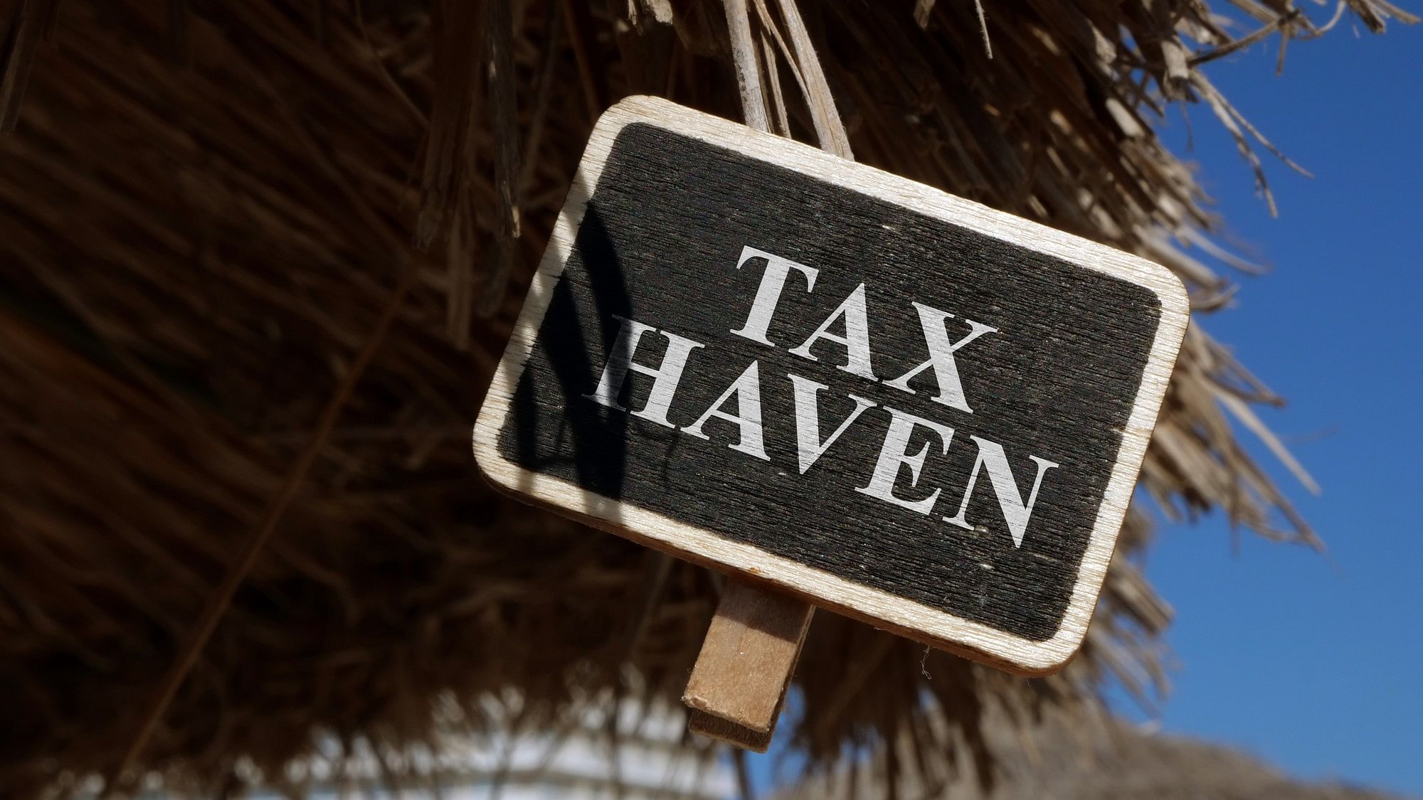 <div class="paragraphs"><p>Representative image with the words 'Tax Haven' visible on a board</p></div>