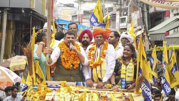 <div class="paragraphs"><p>AAP leader Sanjay Singh with AAP candidate from Sohna constituency Dharmendra Khatana and others during a nomination roadshow for the upcoming Haryana Assembly elections, in Gurugram district. </p></div>