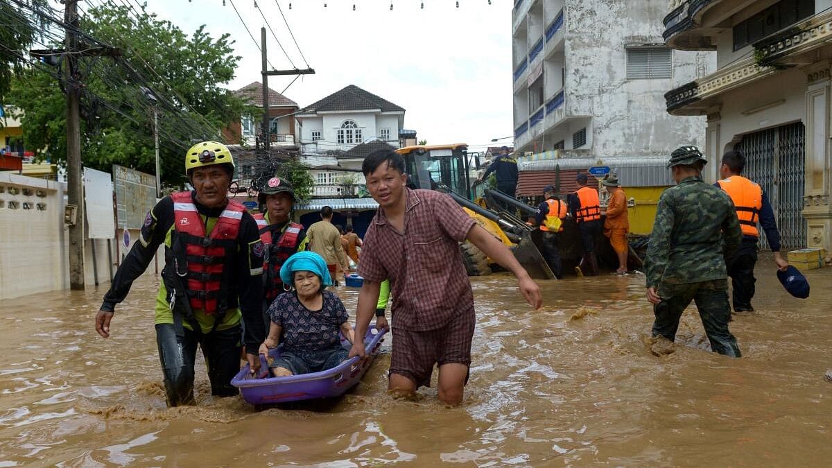 <div class="paragraphs"><p>Rescue workers help a stranded woman from a flooded area at the border town of Mae Sai, following the impact of Typhoon Yagi, in the northern province of Chiang Rai, Thailand, September 12, 2024.</p></div>