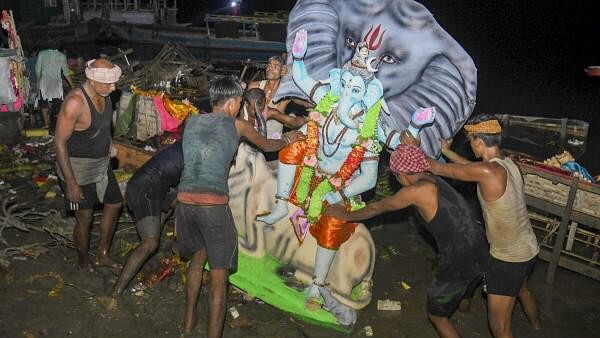 <div class="paragraphs"><p>Devotees carry an idol of Lord Ganesh for immersion during ‘Ganesh Chaturthi’ festival.</p></div>