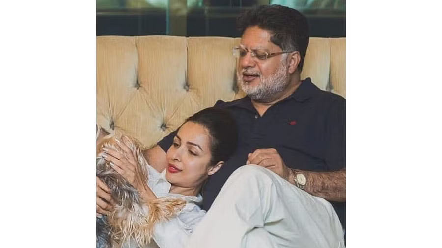 <div class="paragraphs"><p>Malaika Arora with her father.</p></div>