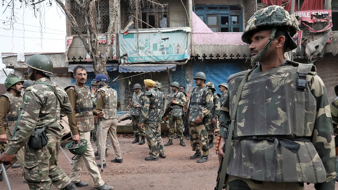 <div class="paragraphs"><p>File photo of police standing guard in a riot-affected area following clashes between people demonstrating for and against a new citizenship law in New Delhi, 2020. </p></div>