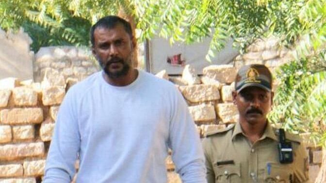 <div class="paragraphs"><p>Actor Darshan(L) walks from the special security room of Bellary Jail to the visitor's room.</p></div>