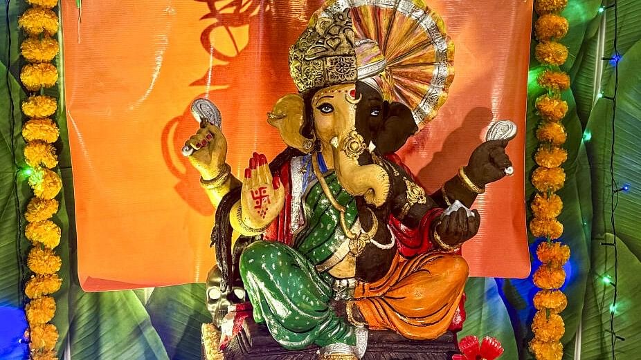 <div class="paragraphs"><p>: A 25-inch Lord Ganesh idol made by Mumbai resident Rintu Rathod using 20 kg of dark chocolate and 10 kg of white chocolate. The idol has been given 'Ardhanari' form in an attempt to highlight the recent incident of alleged sexual assault and murder of a trainee doctor in Kolkata.</p></div>