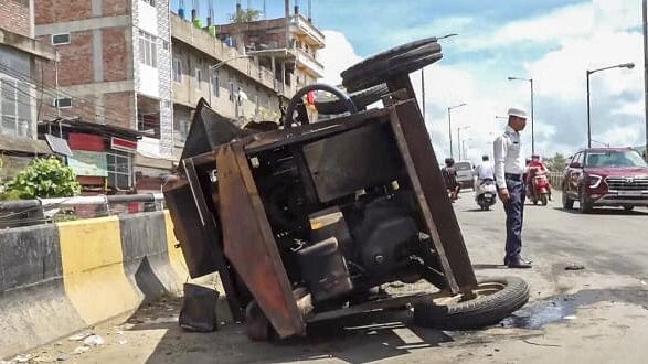 <div class="paragraphs"><p>An overturned vehicle during curfew, which was imposed in the state's capital on Tuesday after students clashed with security forces during their march to Raj Bhavan, in Imphal, Wednesday, Sept 11, 2024.</p></div>