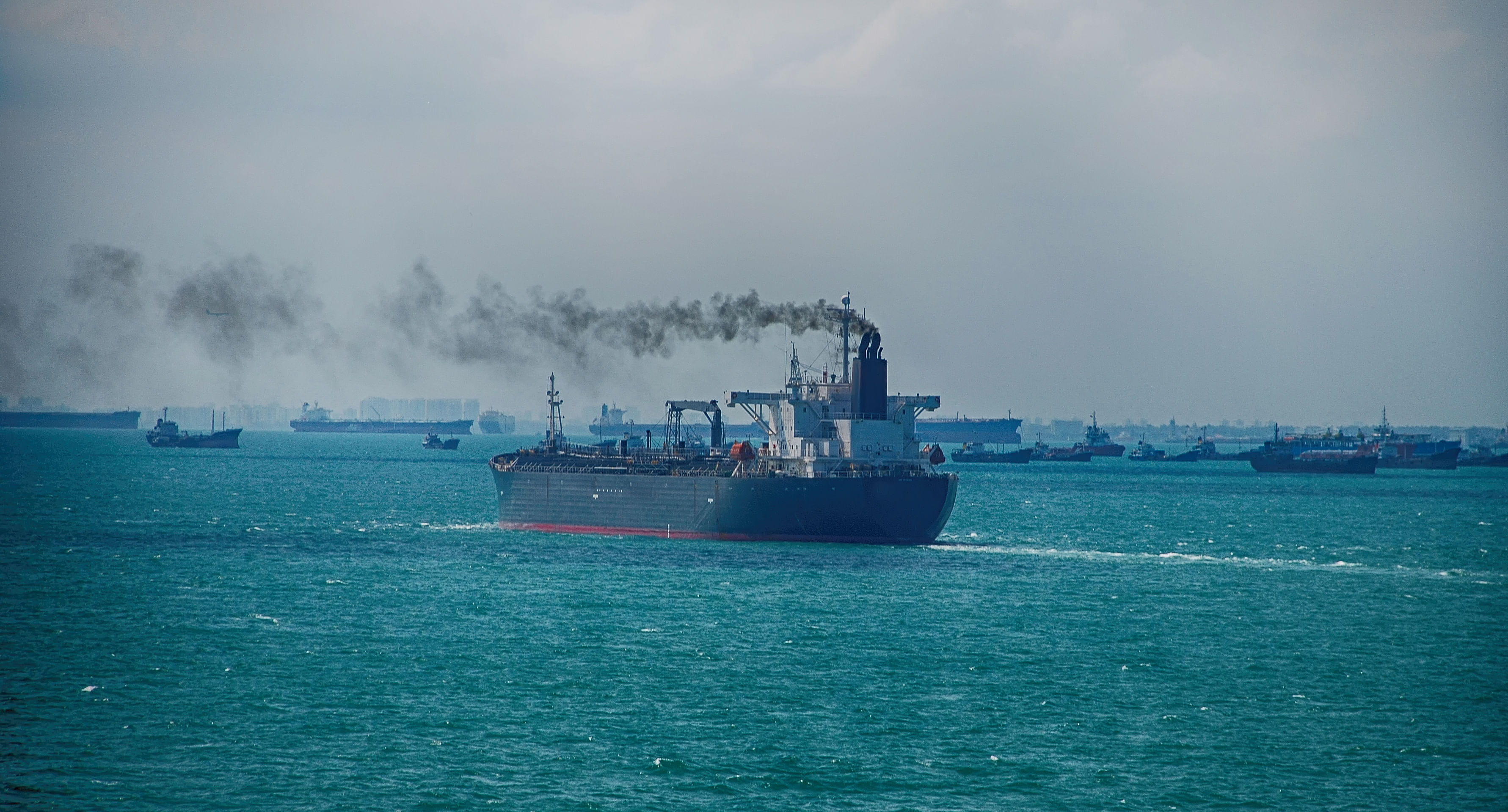 Black Smoke from Ship Sailing on the High Sea