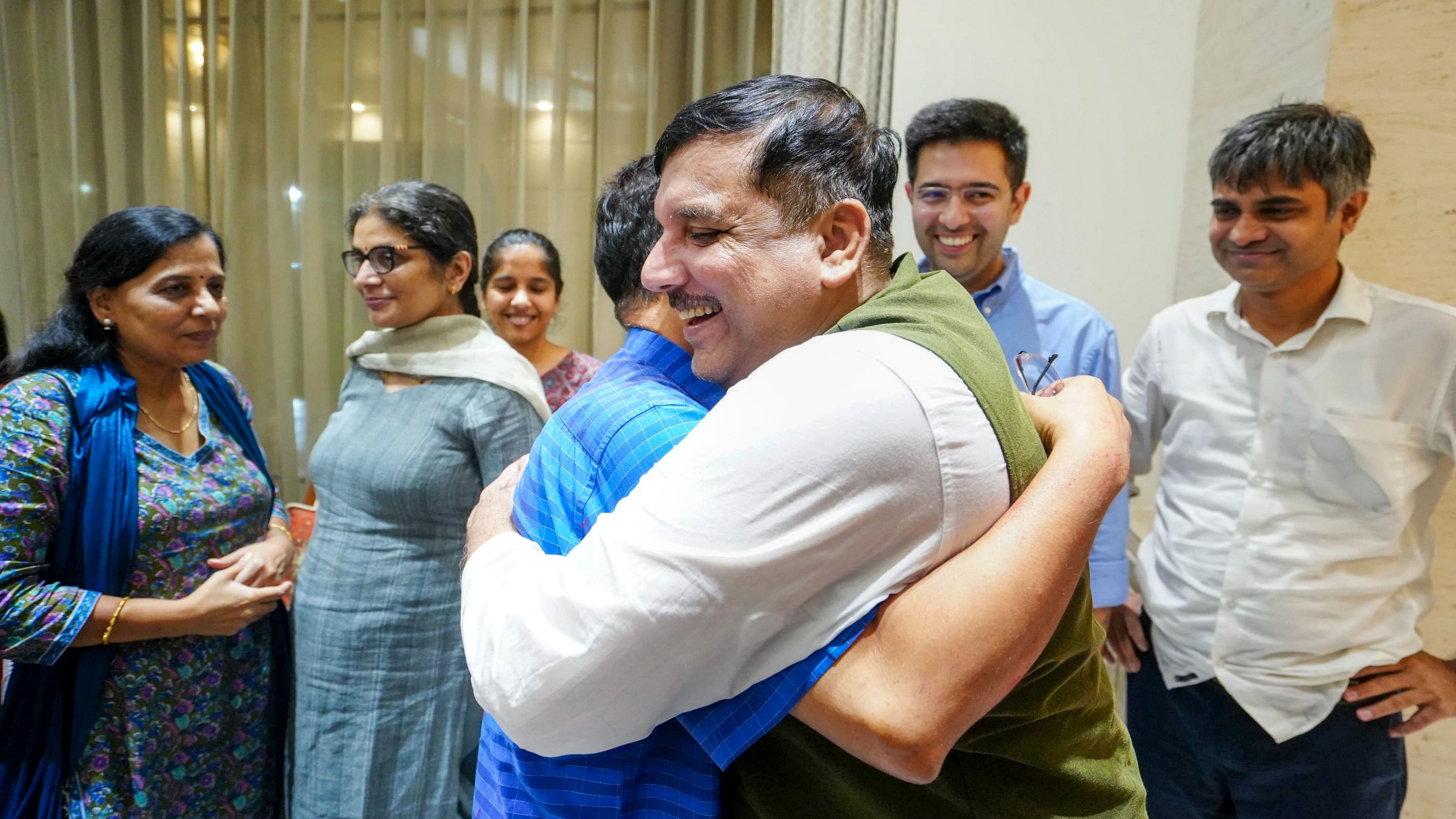 <div class="paragraphs"><p>Delhi Chief Minister Arvind Kejriwal being greeted by party leader Sanjay Singh.</p></div>