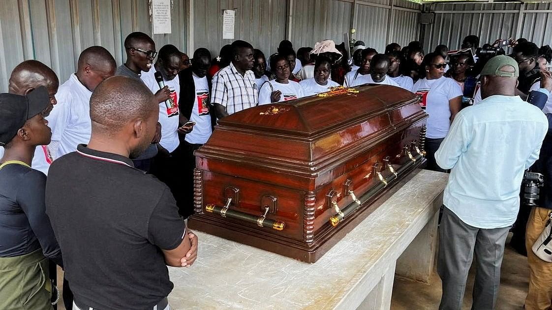 <div class="paragraphs"><p>Family members mourn and react next to the coffin of the slain Olympian Rebecca Cheptegei, who died after her former boyfriend doused her in petrol and set her ablaze.</p></div>