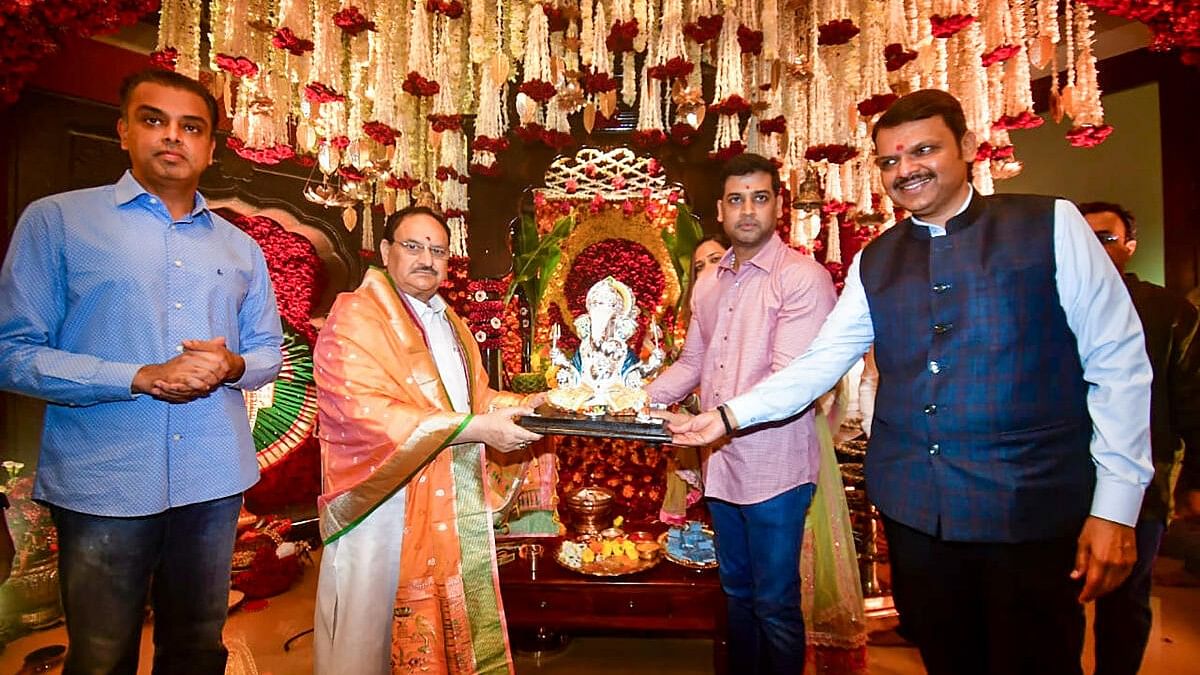 <div class="paragraphs"><p>BJP National President JP Nadda, Maharashtra Deputy Chief Minister Devendra Fadnavis and others during Ganesh Chaturthi festival, at the Fadnavis' residence in Mumbai.</p></div>