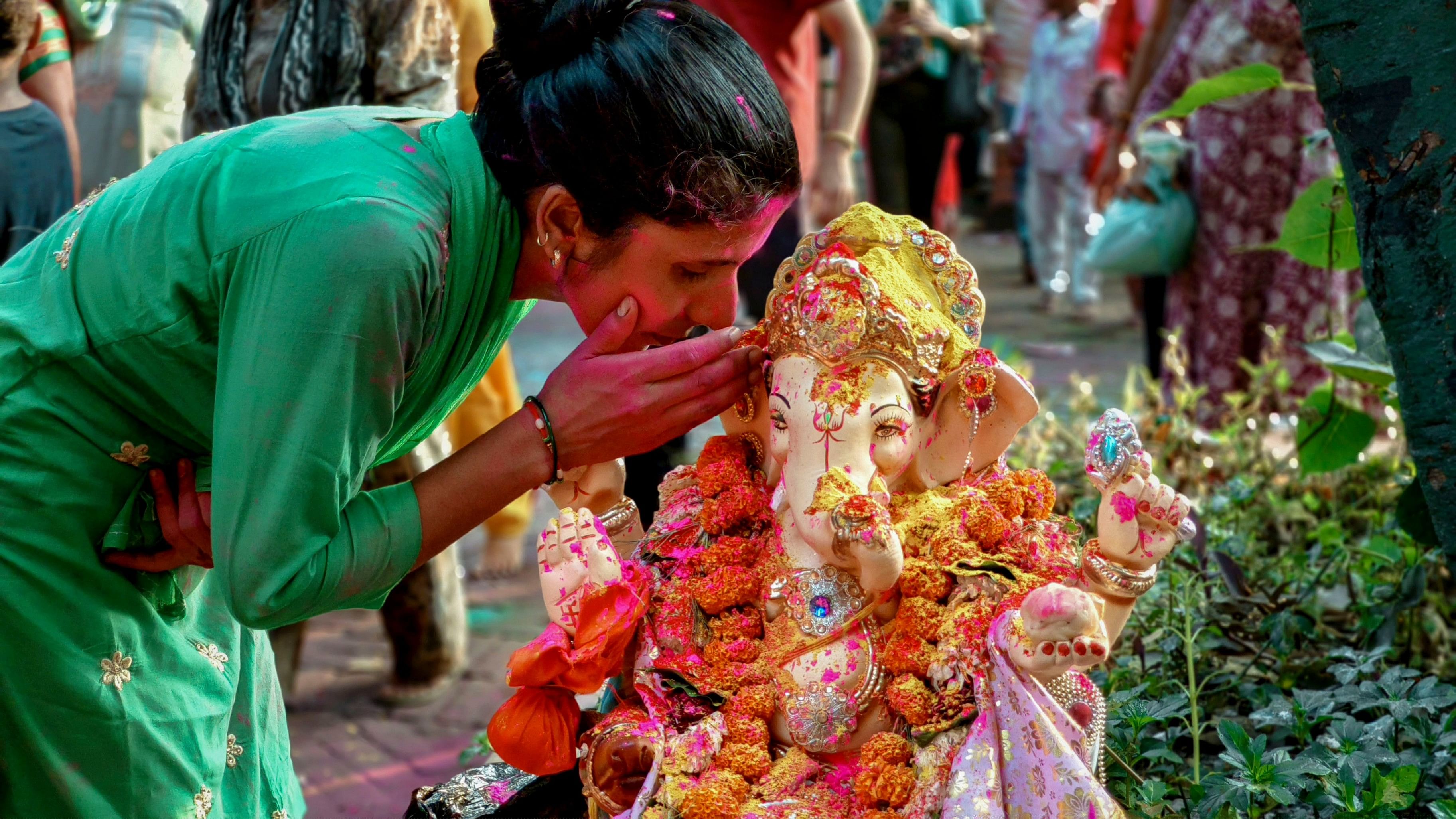 <div class="paragraphs"><p>A devotee performs rituals during a Lord Ganesha idol immersion procession. Representative image.</p></div>