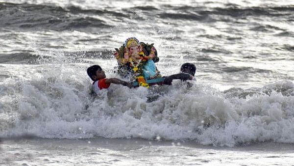 <div class="paragraphs"><p>Devotees immerse an idol of Lord Ganesha in the Arabian Sea during the Ganesh Chaturthi festival, at Juhu Chowpati in Mumbai.&nbsp;</p></div>