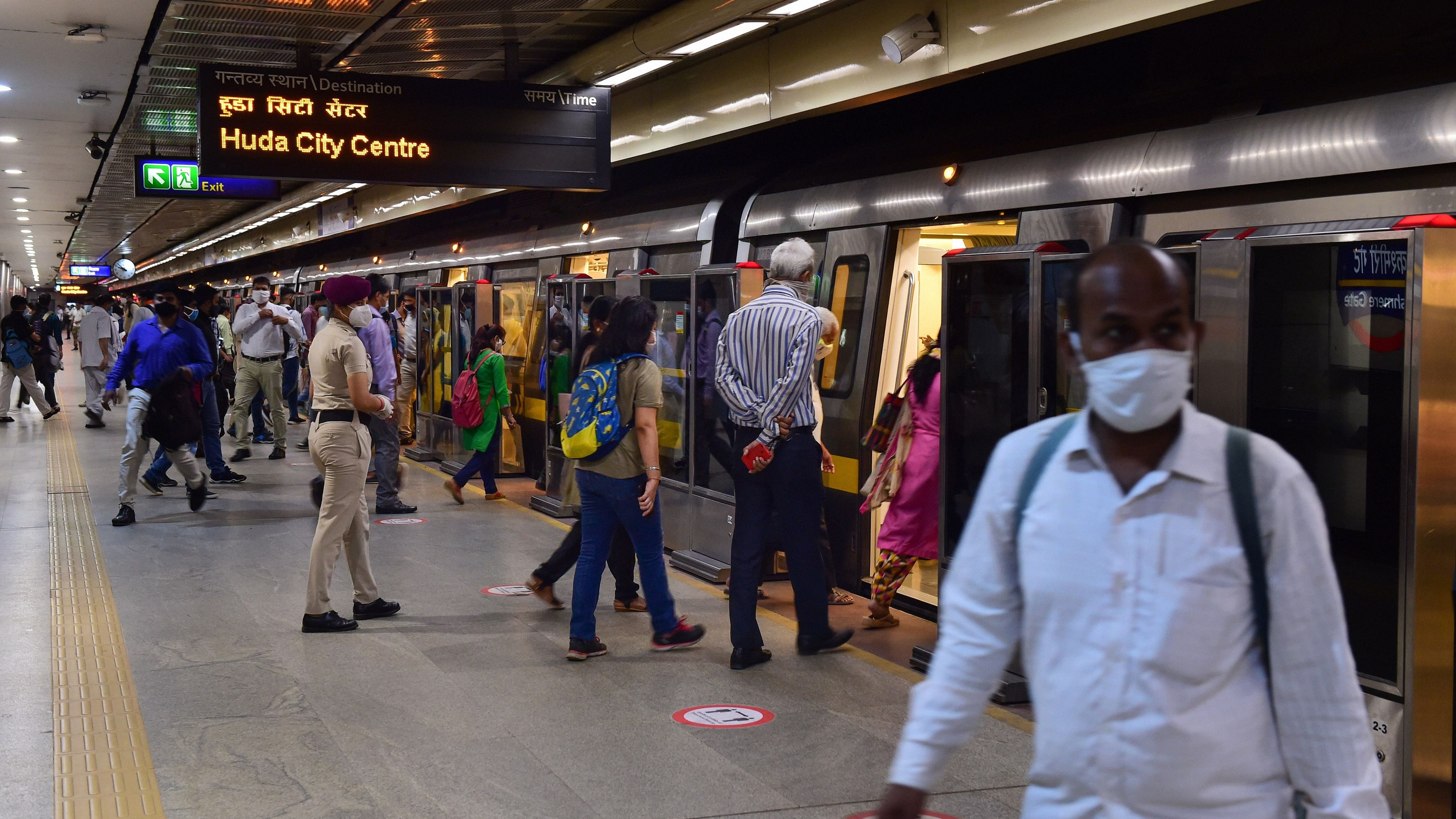 <div class="paragraphs"><p>Passengers board a metro train on the Yellow Line of the Delhi Metro.</p></div>