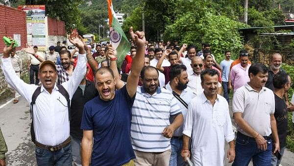 <div class="paragraphs"><p>People march during a protest called by Hindu organisations against the alleged illegal construction at a mosque, in Shimla district.&nbsp;</p></div>