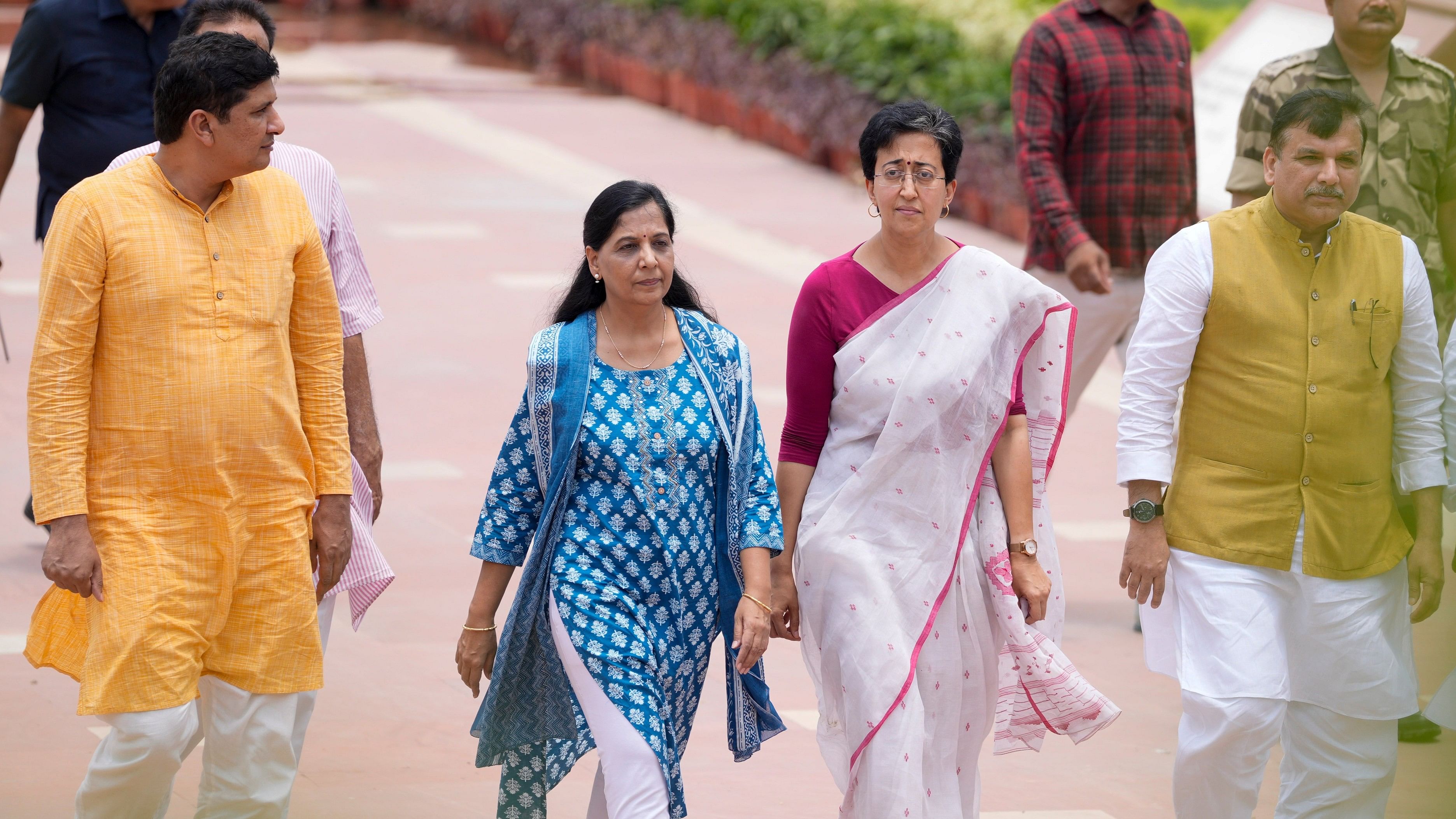 <div class="paragraphs"><p>New Delhi: Delhi Ministers Atishi and Saurabh Bharadwaj, AAP MP Sanjay Singh and Delhi Chief Minister Arvind Kejriwal's wife Sunita Kejriwal leave from the Rajghat, in New Delhi, Friday, June 21, 2024. </p></div>