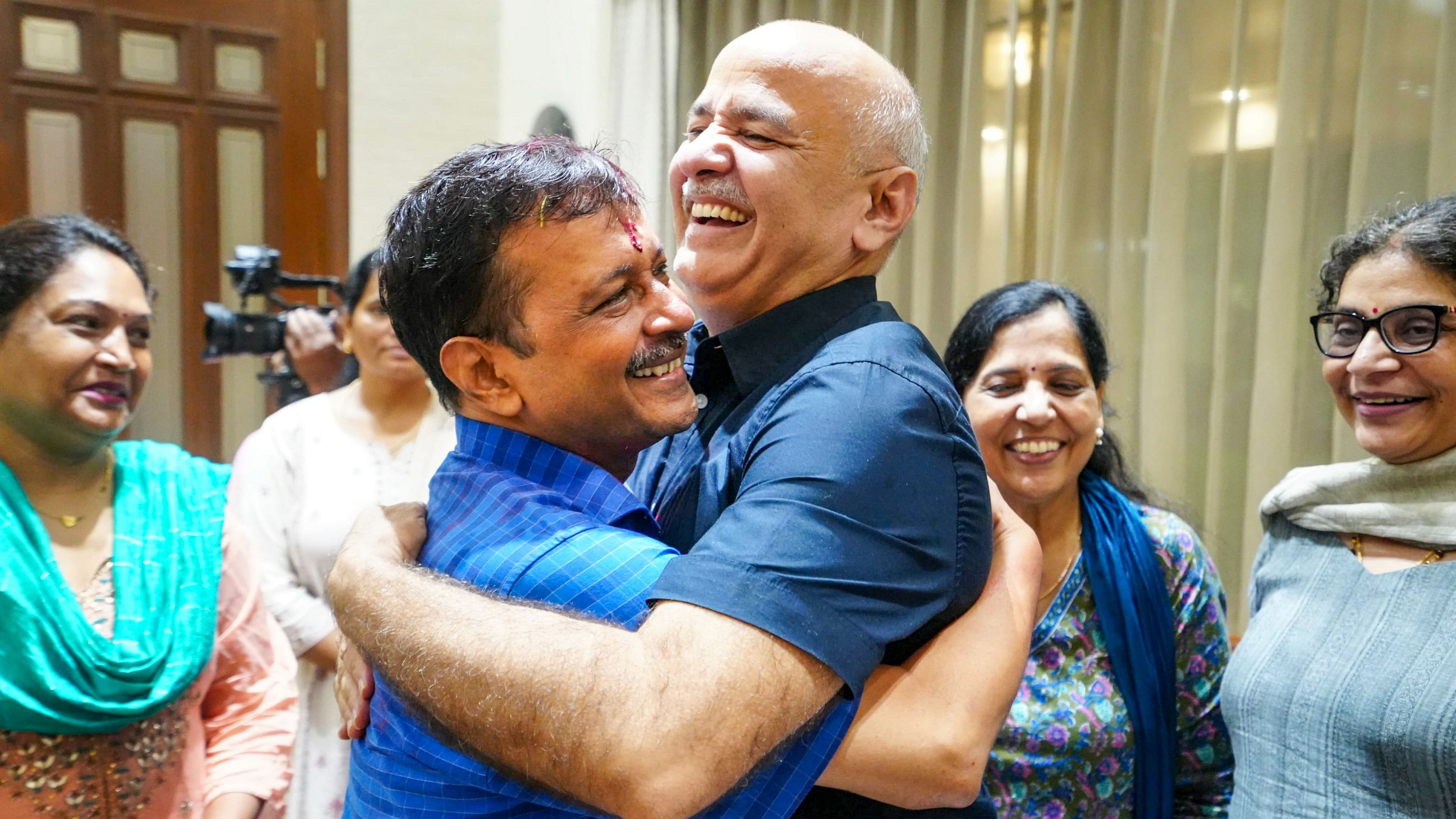 <div class="paragraphs"><p>Delhi Chief Minister Arvind Kejriwal being greeted by party leader Manish Sisodia as he arrives at his residence after being released from Tihar Jail on bail, in New Delhi, Friday.</p></div>