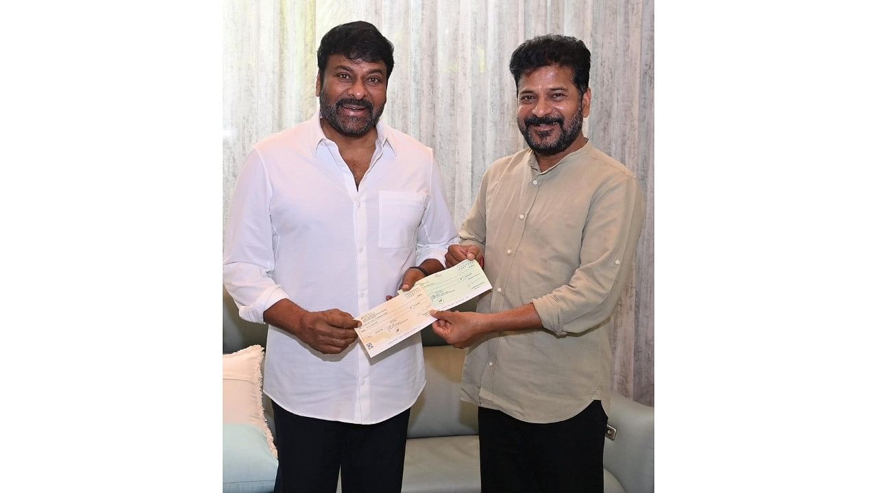 <div class="paragraphs"><p>Chiranjeevi hands over the cheque to A Revanth Reddy.</p></div>