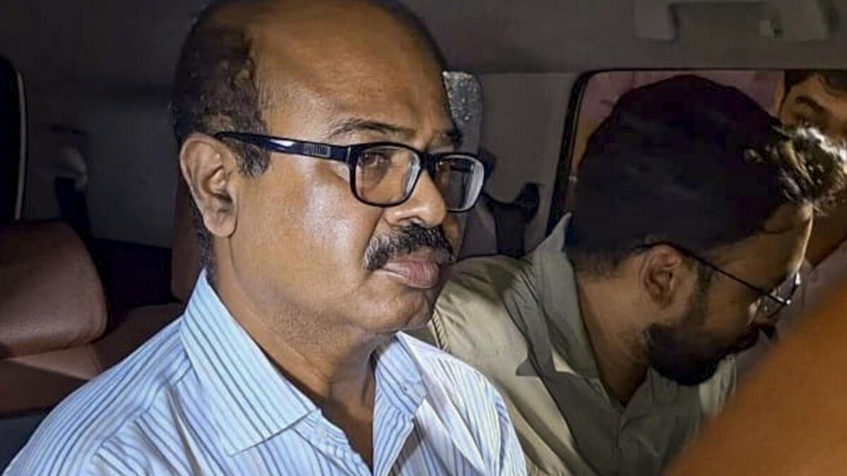 <div class="paragraphs"><p>Officer-in-Charge of Tala Police Station, Abhijit Mondal, being arrested by the CBI in connection with the alleged rape and murder of a trainee doctor, in Kolkata.</p></div>